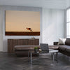 Animal wall art and canvas prints of Lone Kangaroo Plains on a stretched canvas displayed from an angle in a room