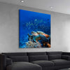 Animal wall art and canvas prints of Ocean Turtle Reef on a stretched canvas displayed from an angle in a room
