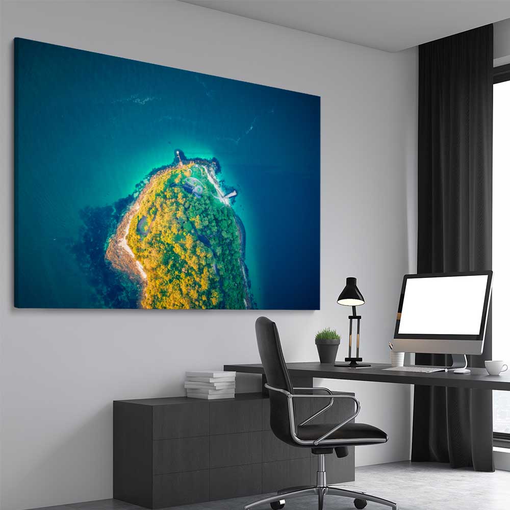 Beach and coastal wall art print of Bradleys Head Aerial on a stretched canvas displayed from an angle in a room