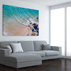 Beach and coastal wall art print of Byron Bay Rocks on a stretched canvas displayed from an angle in a room