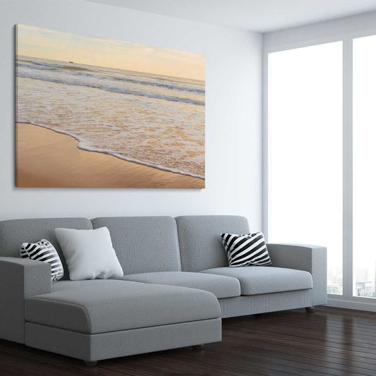 Beach and coastal wall art print of Calm Tides on a stretched canvas displayed from an angle in a room
