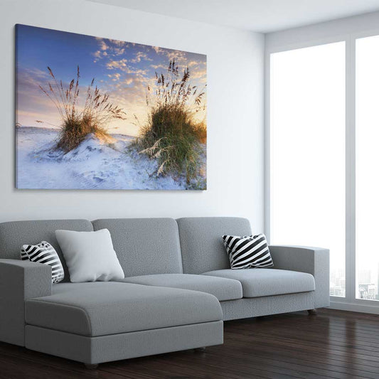 Beach and coastal wall art print of Coastal Sunrise on a stretched canvas displayed from an angle in a room