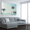 Beach and coastal wall art print of Combi Van Palms on a stretched canvas displayed from an angle in a room