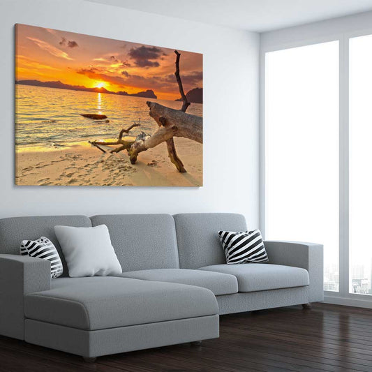 Beach and coastal wall art print of Driftwood at Sunset on a stretched canvas displayed from an angle in a room
