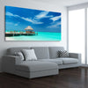 Beach and coastal wall art print of Exotic Beach Bar on a stretched canvas displayed from an angle in a room