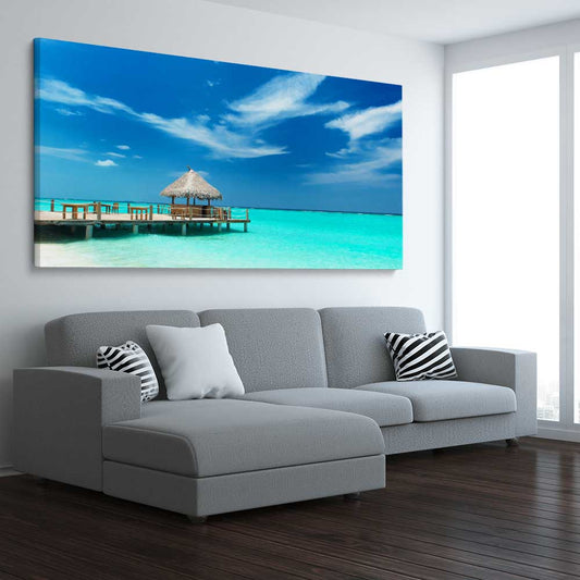 Beach and coastal wall art print of Exotic Beach Bar on a stretched canvas displayed from an angle in a room