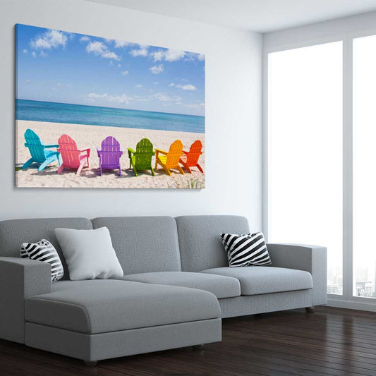 Beach and coastal wall art print of Pastel Chairs on a stretched canvas displayed from an angle in a room