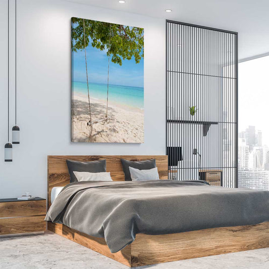Beach and coastal wall art print of Pristine Beach Swing on a stretched canvas displayed from an angle in a room