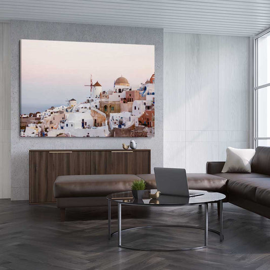 Beach and coastal wall art print of Santorini Sunrise on a stretched canvas displayed from an angle in a room