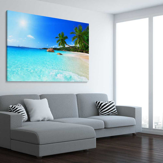 Beach and coastal wall art print of Seychelles Crystal Water on a stretched canvas displayed from an angle in a room