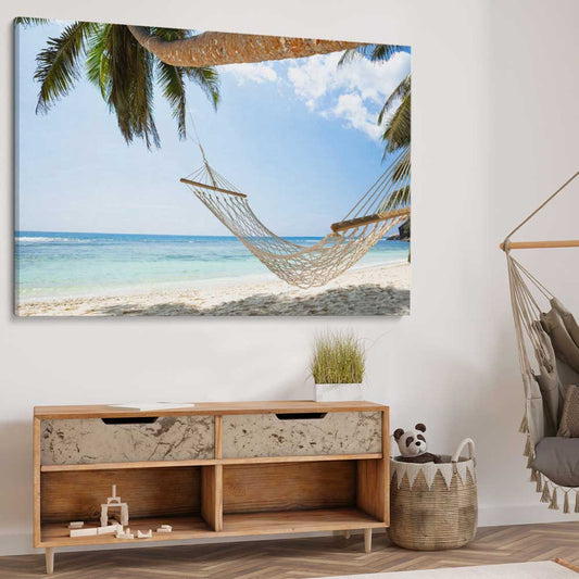 Beach and coastal wall art print of Seychelles Hammock on a stretched canvas displayed from an angle in a room