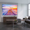 Beach and coastal wall art print of Walking Into Stillness on a stretched canvas displayed from an angle in a room
