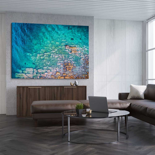 Beach and coastal wall art print of Watsons Bay Rocks on a stretched canvas displayed from an angle in a room