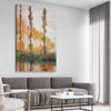 Classic wall art and canvas print of Poplars Claude Monet on a stretched canvas displayed from an angle in a room