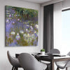 Classic wall art and canvas print of Water Lilies Claude Monet on a stretched canvas displayed from an angle in a room