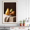 Three Pears stretched canvas displayed from an angle in a room is a colourful and stylish canvas wall art and print suited for the kitchen area