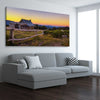 Floral print of Craigs Hut at Sunset on a stretched canvas displayed from an angle in a room