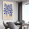 Floral print of Indigo Botanica on a stretched canvas displayed from an angle in a room