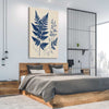 Floral print of Indigo Fern on a stretched canvas displayed from an angle in a room
