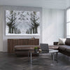 Floral print of Winter Tree Avenue on a stretched canvas displayed from an angle in a room