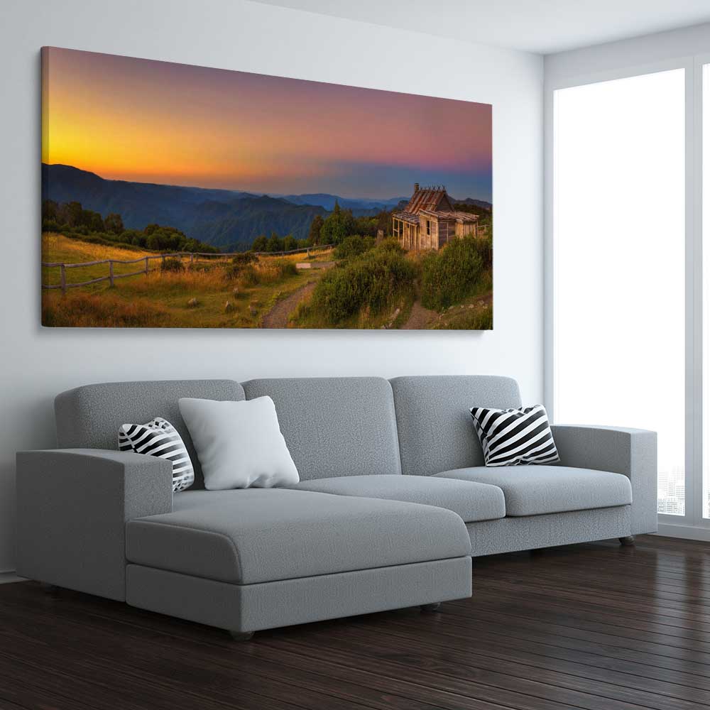 Floral print of Craigs Hut Victorian Alps on a stretched canvas displayed from an angle in a room