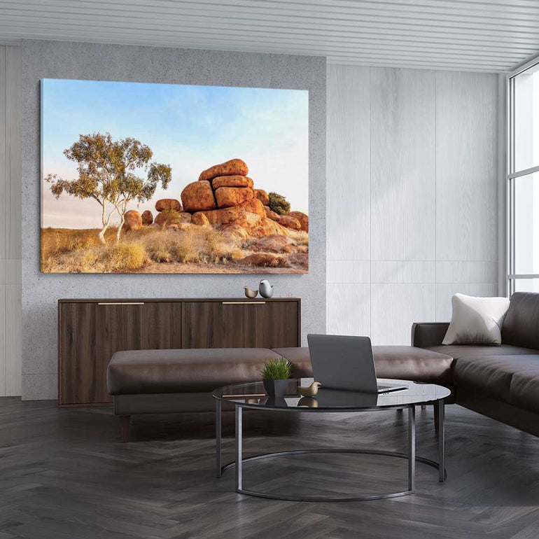 Floral print of Devils Marbles on a stretched canvas displayed from an angle in a room