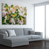 Floral print of Green Blossom on a stretched canvas displayed from an angle in a room