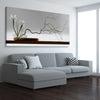 Floral print of Growing Ikebana on a stretched canvas displayed from an angle in a room