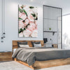 Floral print of Pink Peonies on a stretched canvas displayed from an angle in a room