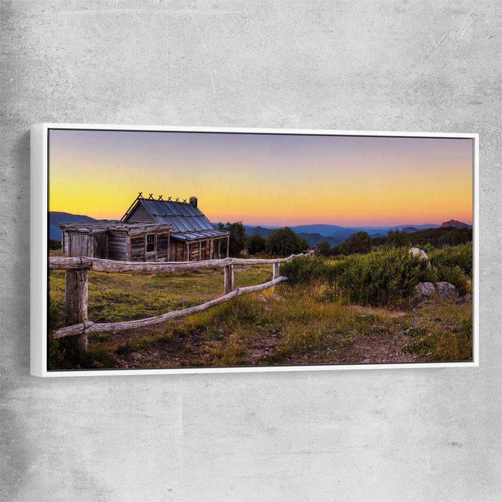Floral print of Craigs Hut at Sunset with white framed canvas