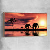 Animal wall art and canvas prints of Elephant Family Dawn with raw oak framed canvas