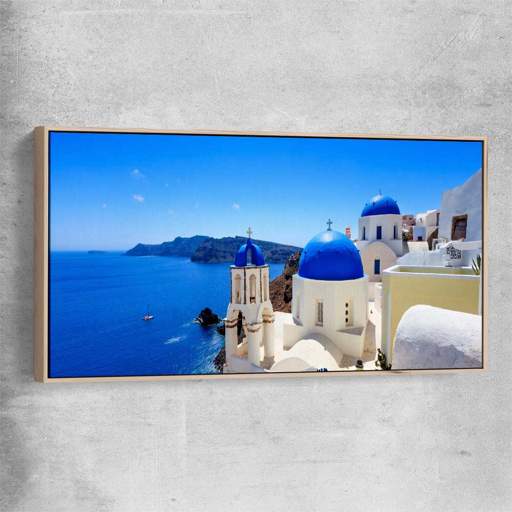 Beach and coastal wall art print of Santorini Cliffside with raw oak framed canvas