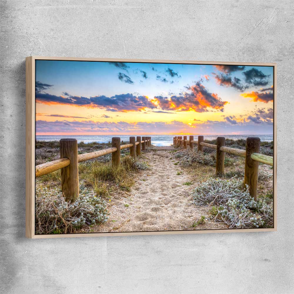Beach and coastal wall art print of Quiet Sunset Walk with raw oak framed canvas