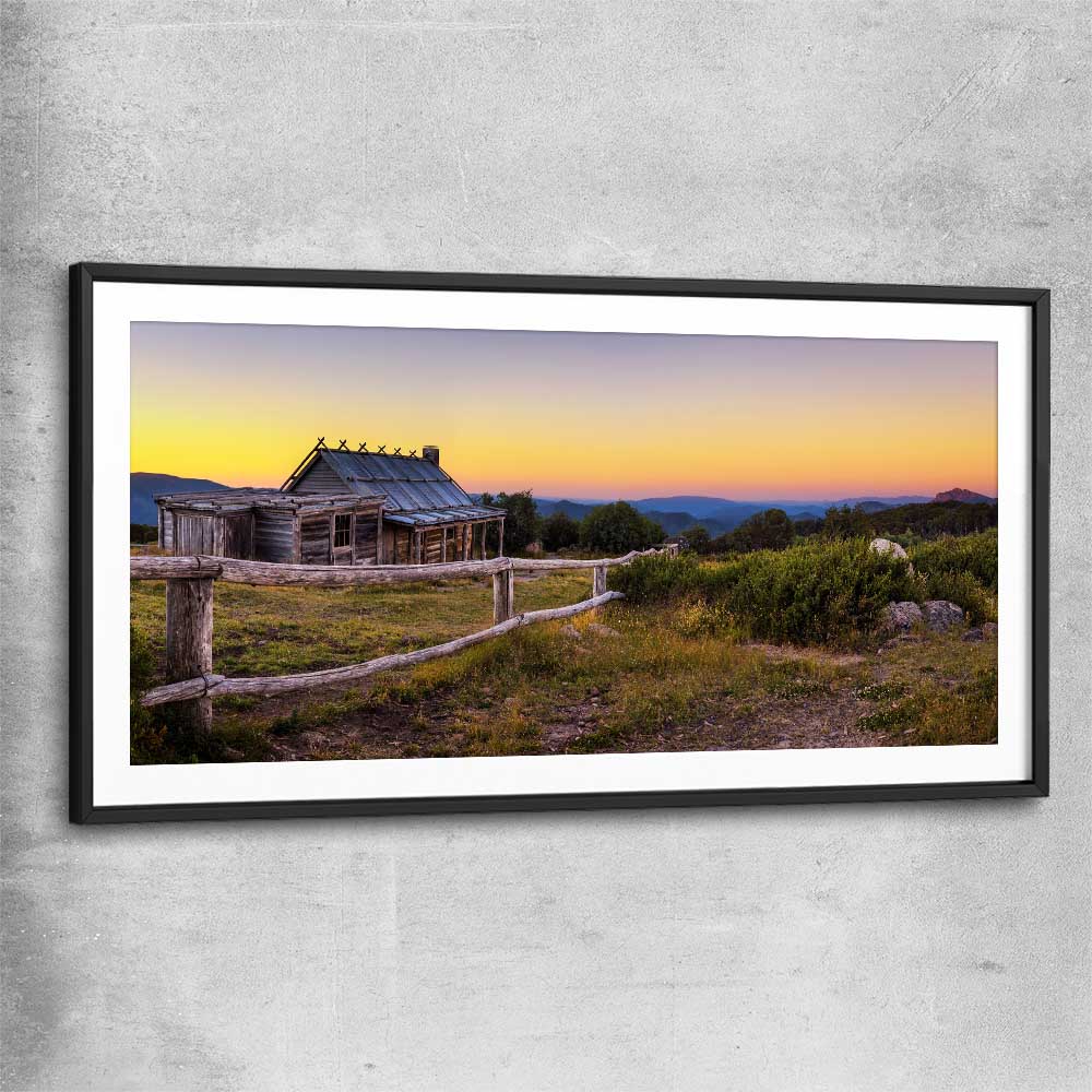 Floral print of Craigs Hut at Sunset with black glass front frame