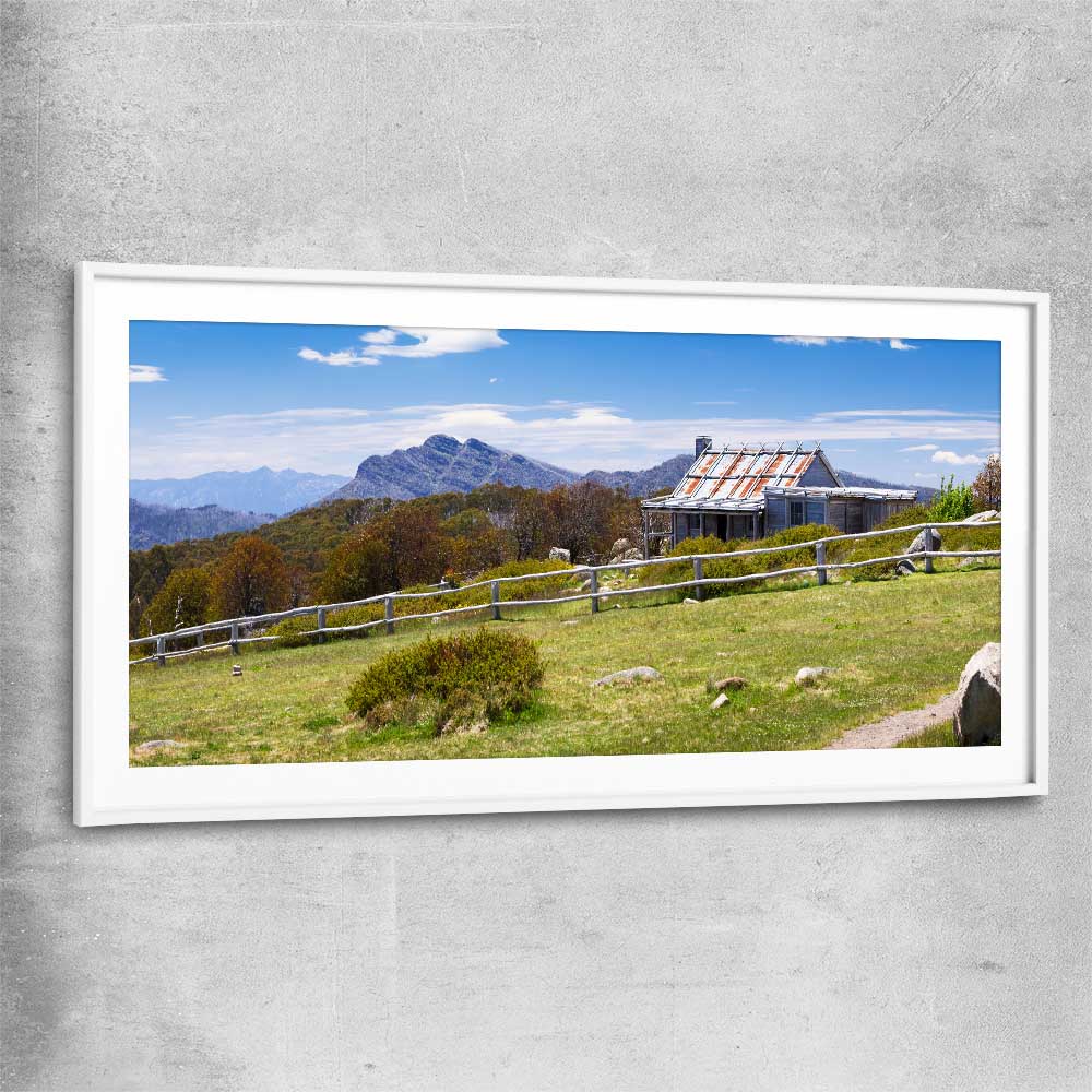 Floral print of Victorian Alps Craigs Hut with white glass front frame