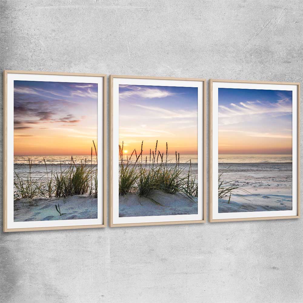 Beach and coastal wall art print of Calming Sunset Set with raw oak glass front frame