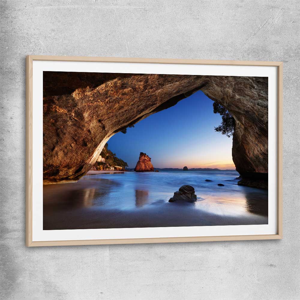 Beach and coastal wall art print of Cathedral Cove New Zealand with raw oak glass front frame