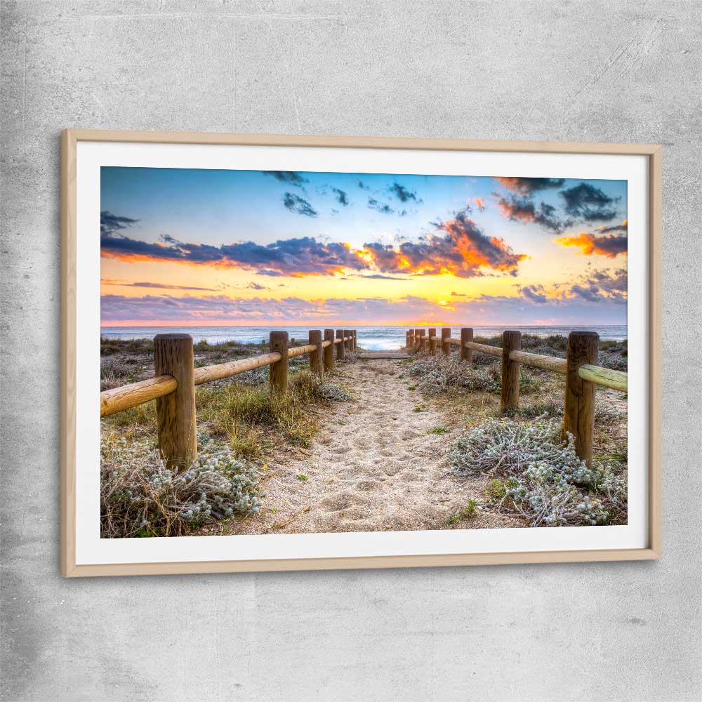 Beach and coastal wall art print of Quiet Sunset Walk with raw oak glass front frame