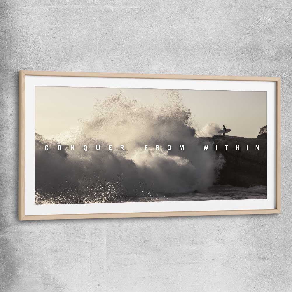 Inspirational wall art print of Conquer with raw oak glass front frame