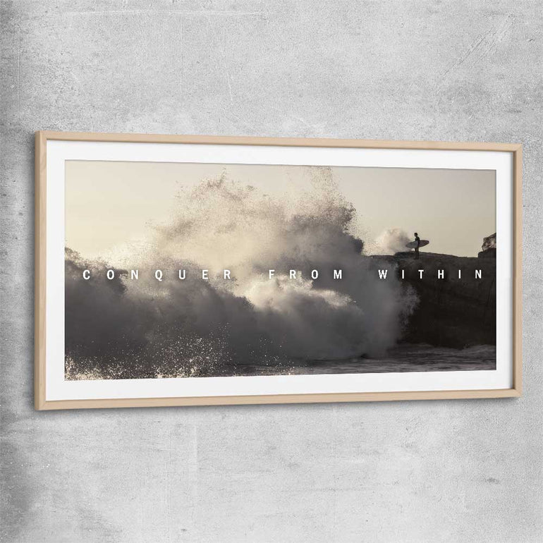 Inspirational wall art print of Conquer with raw oak glass front frame