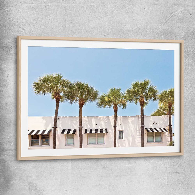 Floral print of South Miami Palms with raw oak glass front frame